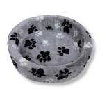 Bovenaanzicht van de NapZZZ ovale bontmand in grijs met grote pootafdruk, toont de diepe ovale vorm en zachte imitatiebont bekleding.