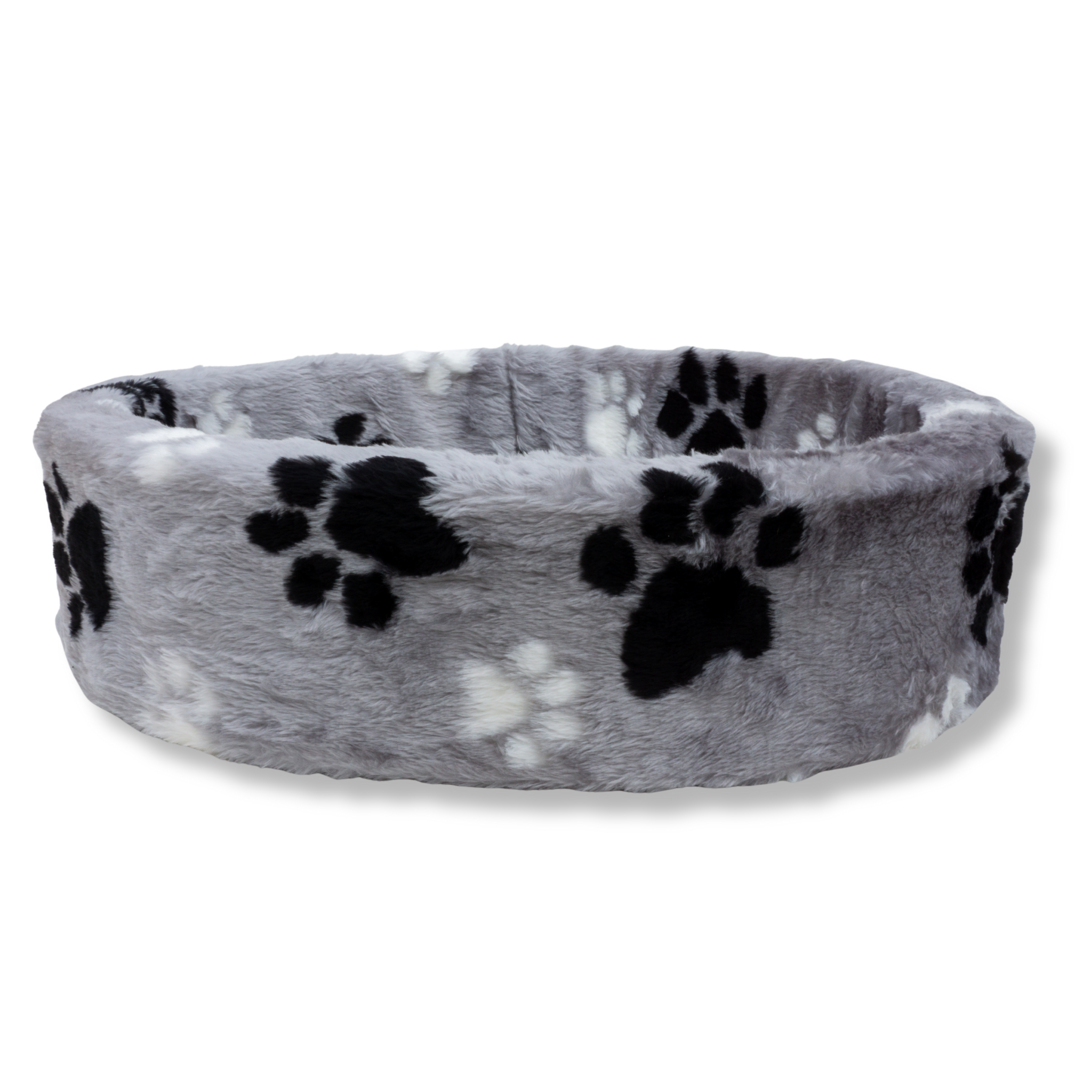 Zijaanzicht van de NapZZZ ovale bontmand met pootjesprint in zwart en wit, bekleed met zacht imitatiebont en een diepe ovale vorm.