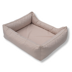 Napzzz divan hondenmand oxford beige creme in zijaanzicht van achterkant. Stevige hondenmand met schuimrubberen vlok vulling en schuimrubber omkeerbaar matras. In diverse maten en kleuren.