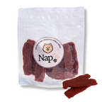 Napzzz hondensnack eend jerky, open verpakking met zichtbare stukjes gedroogde eend, eiwitrijke hondensnack 300g
