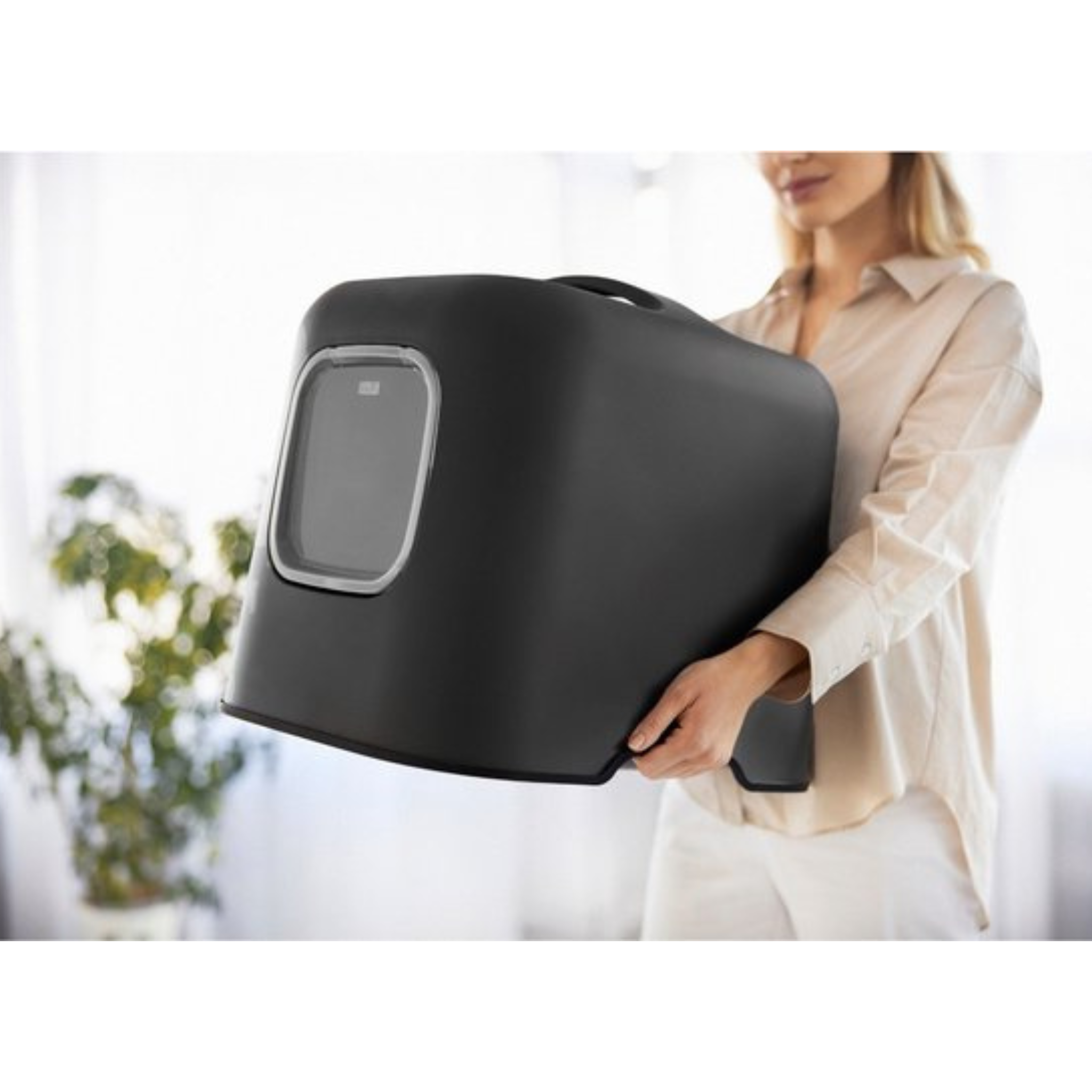 Sfeerfoto Zwart Biala Kattentoilet – Zwart Biala kattentoilet in modern interieur, hygiënisch en praktisch voor katten.